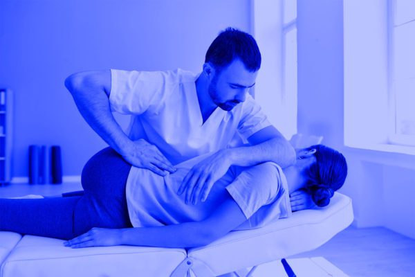 Chiropractor Treating Siatica for a Patient