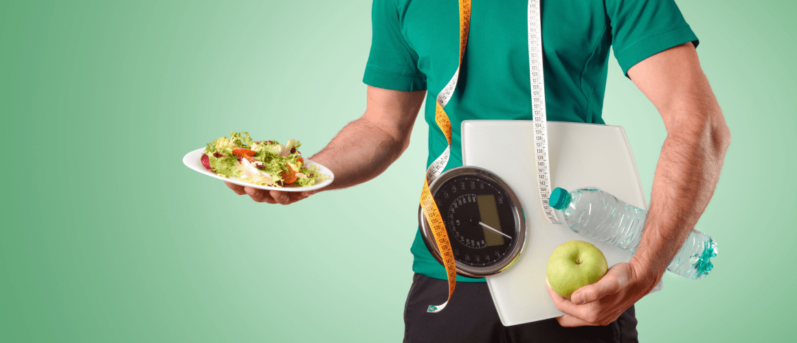 Sports dietitian posing with salad, apple, scale, and measurement tape